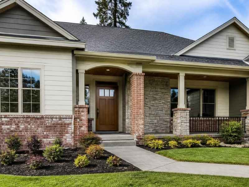 Balanced brick accents around the entry and lower exterior of a home in McKinney, Texas.