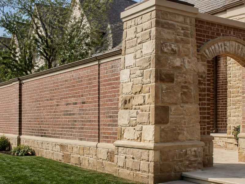 Movement joints incorporated into a large custom brick and stone exterior in McKinney, Texas.